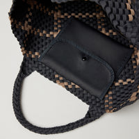 Andreina Bags Siempre tote bag in charcoal colour with beige criss cross stripes. Colour name is ash. Large size yet lightweight. Has an internal attached pocket that closes up. Handmade, interlaced material, synthetic material, water resistant, machine washable. Designed in Sydney, Australia.