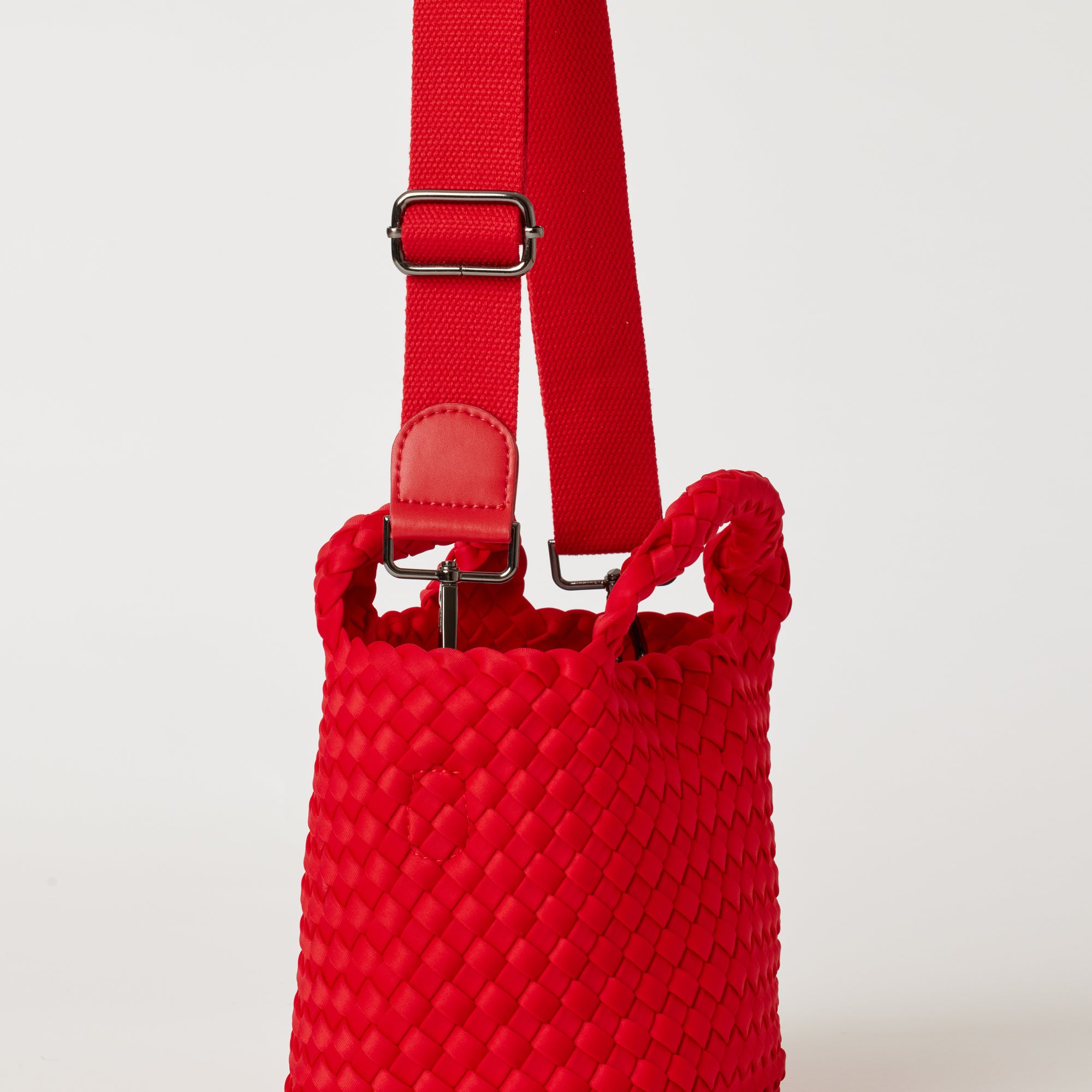 Andreina Bags Lupe crossbody bag in red colour. small size yet roomy. Handmade, interlaced material, synthetic material, water resistant, machine washable, adjustable strap, lightweight. Can be worn as crossbody or as a handbag. Designed in Sydney, Australia.