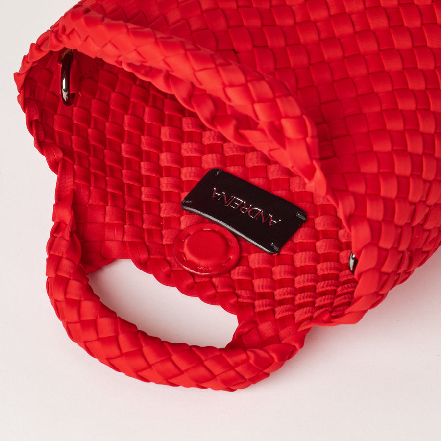 Andreina Bags Lupe crossbody bag in red colour. small size yet roomy. Handmade, interlaced material, synthetic material, water resistant, machine washable, adjustable strap, lightweight. Can be worn as crossbody or as a handbag. Designed in Sydney, Australia.