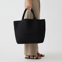 Andreina Bags Siempre tote bag in black colour. Large size yet lightweight. Handmade, interlaced material, synthetic material, water resistant, machine washable. Designed in Sydney, Australia.