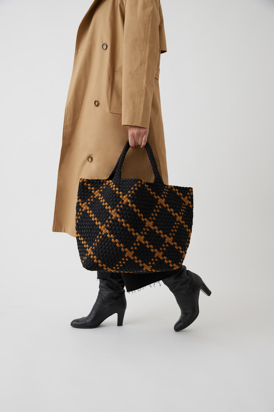 Andreina Bags Siempre tote bag in black colour with mustard criss cross stripes. Colour name is ochre. Large size yet lightweight. Handmade, interlaced material, synthetic material, water resistant, machine washable. Designed in Sydney, Australia.