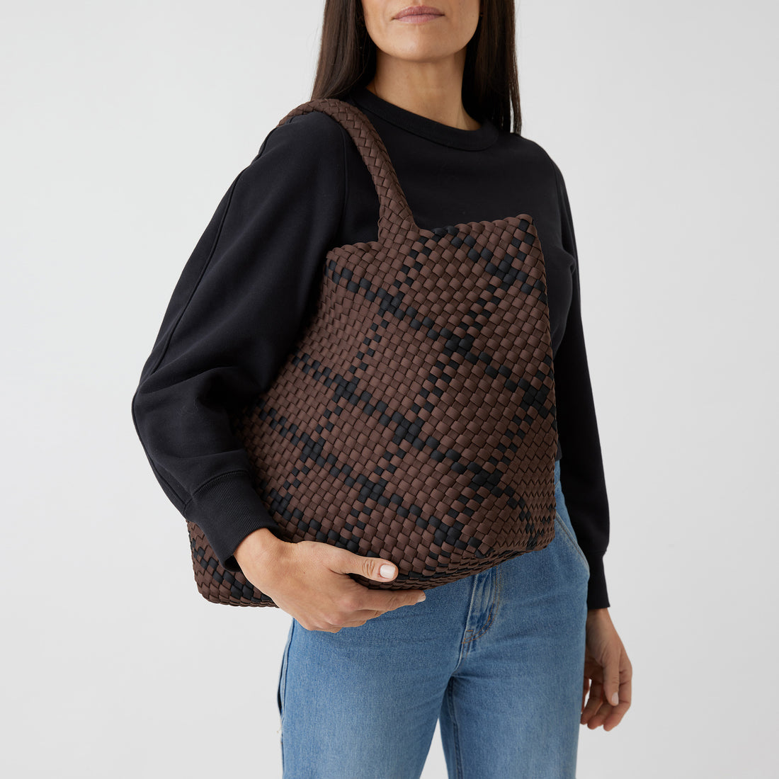 Andreina Bags Siempre tote bag in brown colour with black criss cross stripes. Colour name is cocoa. Large size yet lightweight. Handmade, interlaced material, synthetic material, water resistant, machine washable. Designed in Sydney, Australia.