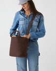 Andreina Bags Ciudad crossbody bag in brown colour. Medium size. Handmade, interlaced material, synthetic material water resistant, machine washable, adjustable strap, lightweight. Can be worn as crossbody or as a handbag. Designed in Sydney, Australia.