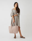 Andreina Bags Siempre tote bag in light pink colour. Colour name is rose. Large size yet lightweight. Handmade, interlaced material, synthetic material, water resistant, machine washable. Designed in Sydney, Australia.