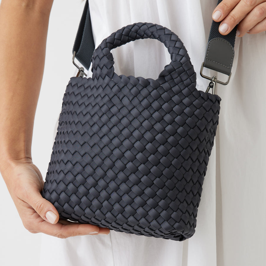 Andreina Bags Lupe crossbody bag in charcoal colour. small size yet roomy. Handmade, interlaced material, synthetic material, water resistant, machine washable, adjustable strap, lightweight. Can be worn as crossbody or as a handbag. Designed in Sydney, Australia.