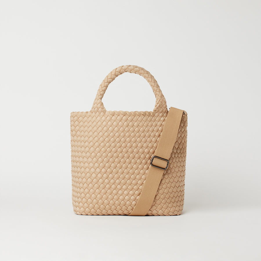 Andreina Bags Ciudad crossbody bag in cream colour. Medium size. Handmade, interlaced material, synthetic material water resistant, machine washable, adjustable strap, lightweight. Can be worn as crossbody or as a handbag. Designed in Sydney, Australia.