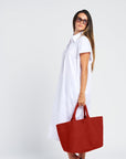 woman with a tote bag in terracotta colour