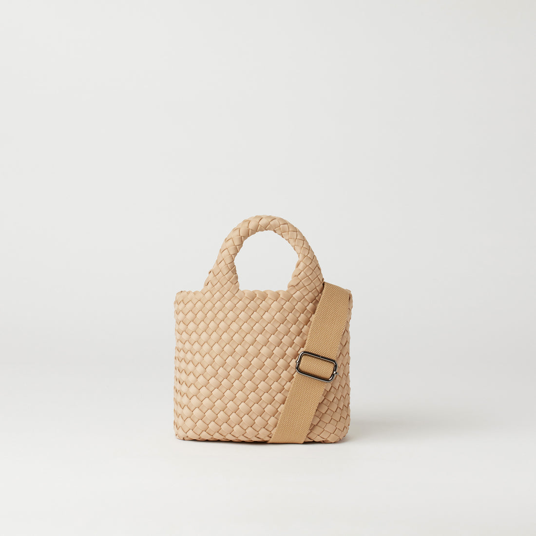 Andreina Bags Lupe crossbody bag in cream colour. small size yet roomy. Handmade, interlaced material, synthetic material, water resistant, machine washable, adjustable strap, lightweight. Can be worn as crossbody or as a handbag. Designed in Sydney, Australia.