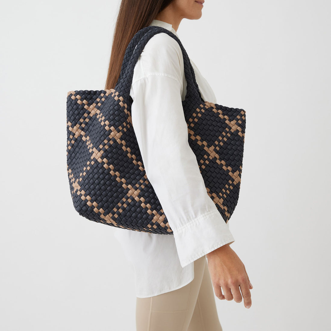 Andreina Bags Siempre tote bag in charcoal colour with beige criss cross stripes. Colour name is Ash. Large size yet lightweight. Handmade, interlaced material, synthetic material, water resistant, machine washable. Designed in Sydney, Australia.